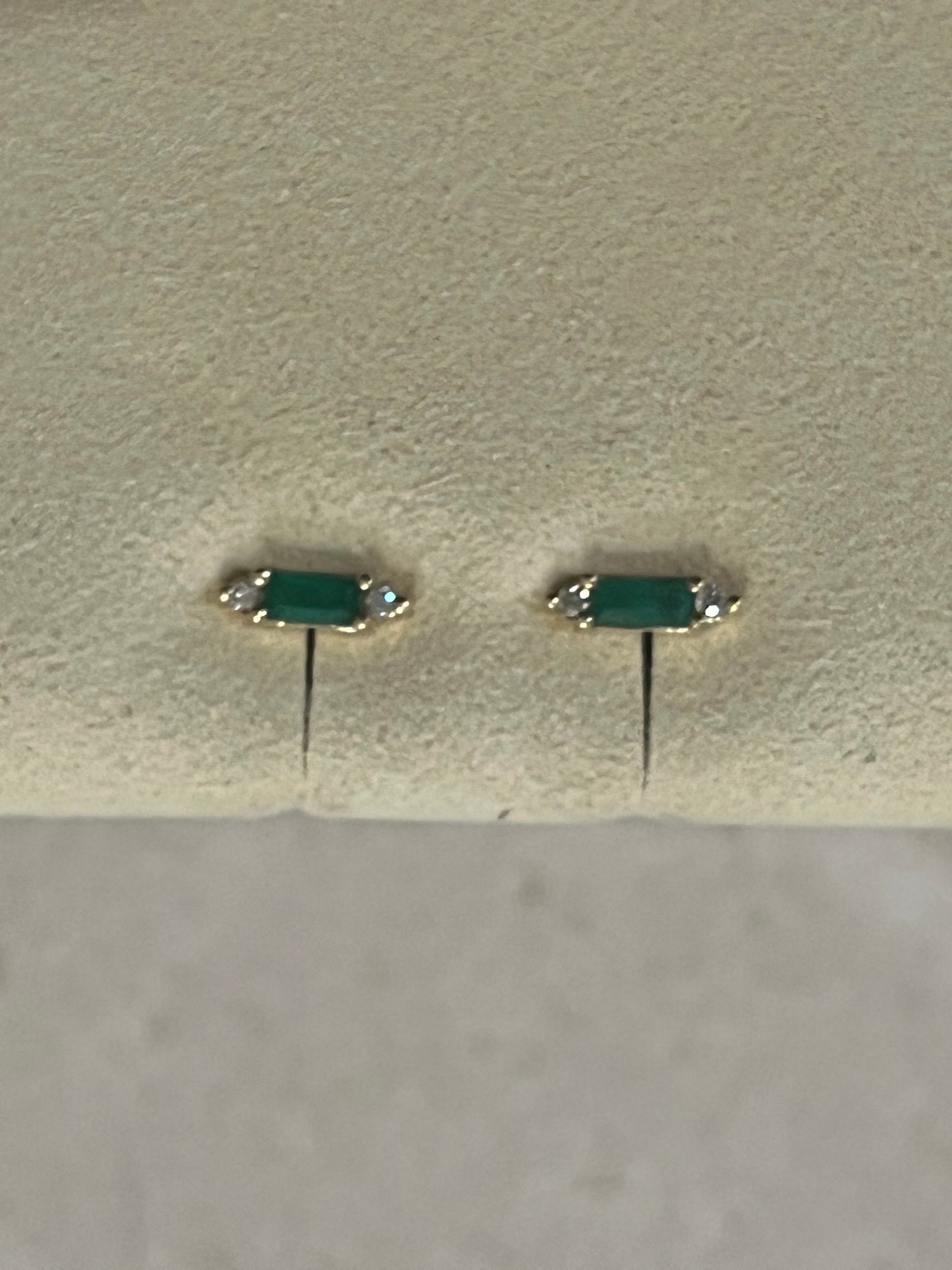 Emerald with White Dimond studs set in 14 carat Gold