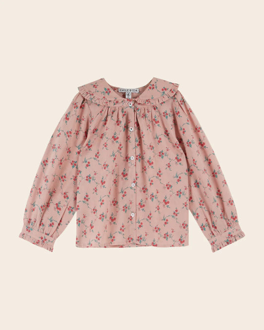Pink blouse with red flowers